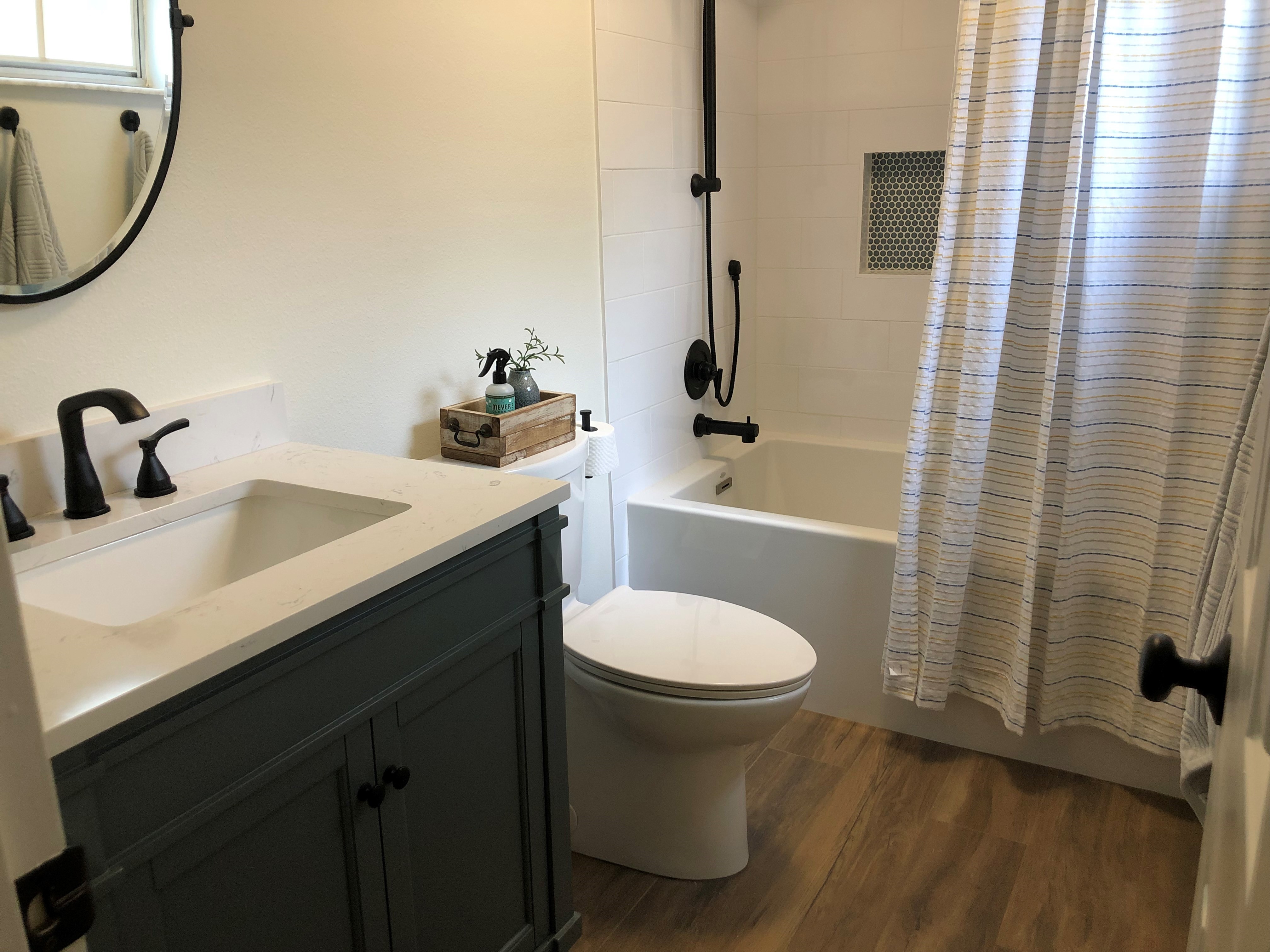 Finished Guest Bathroom -
		An extension of the neutral guest room with finishing touches designed and built by me.